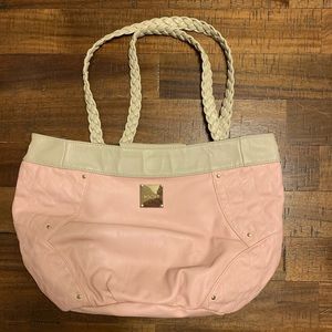 Pink Miche cover with handles.